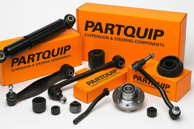 Partquip suspension and steering parts – shock absorbers, control arms, tie rods, rubber mountings, and wheel bearings with orange branded boxes in South Africa